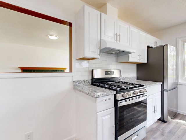 the kitchen of a renovated unit